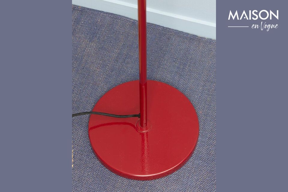 The floor lamp\'s red metal design offers a bold look that perfectly suits any modern or classic