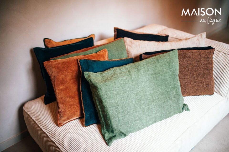 The soft green color of this cushion blends harmoniously with a multitude of decors