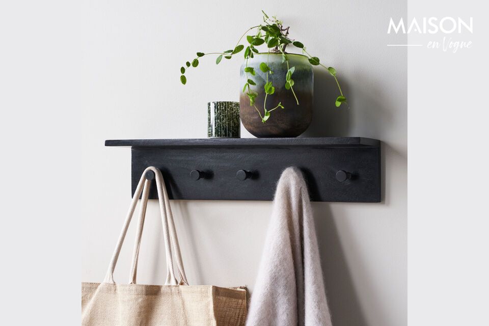 Add elegance and functionality with this black coat rack.