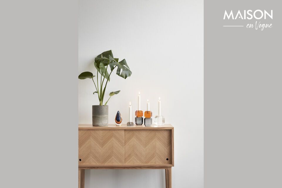 The Herringbone console table in light oak veneer is both practical and aesthetically pleasing