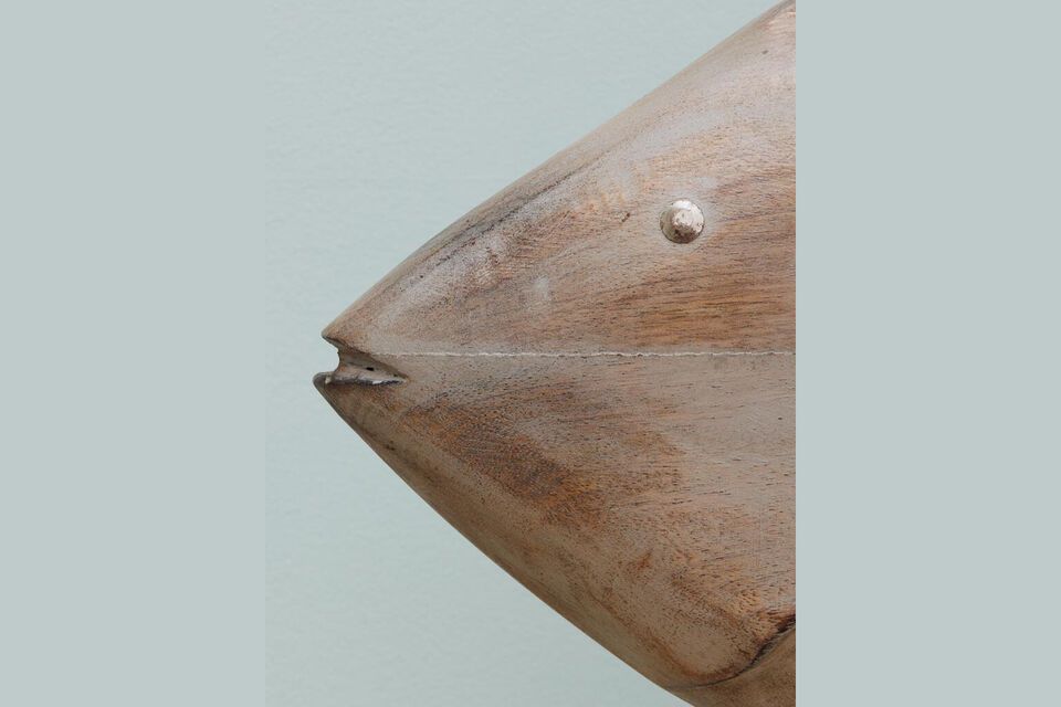 Carefully crafted from wood, this sculpture stands out for its sturdiness and durability