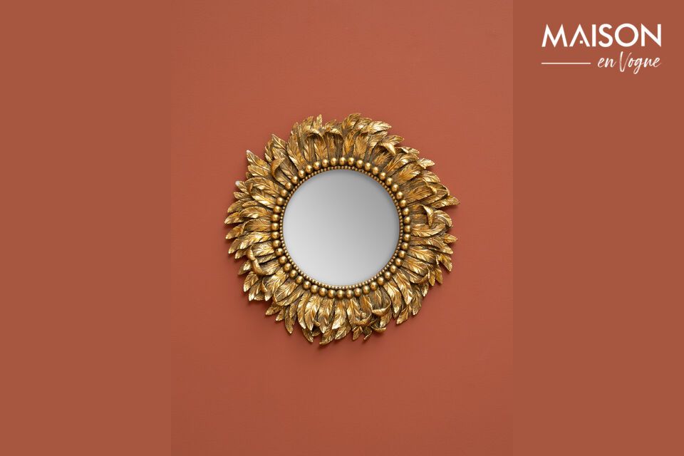 Bring luxury and luminosity to your home with this gold mirror.