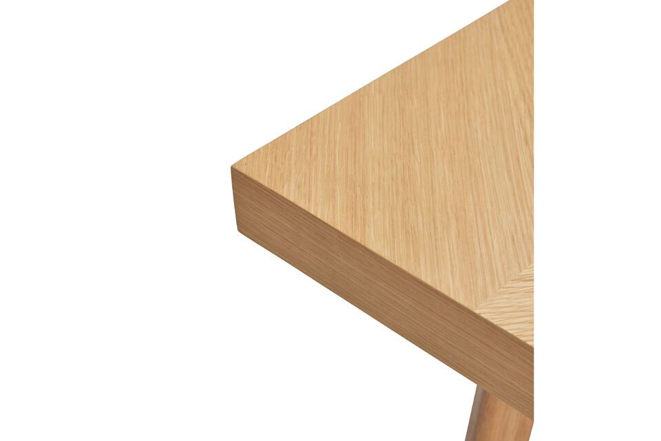 The Herringbone light wood dining table offers a welcoming space for sharing meals with family and