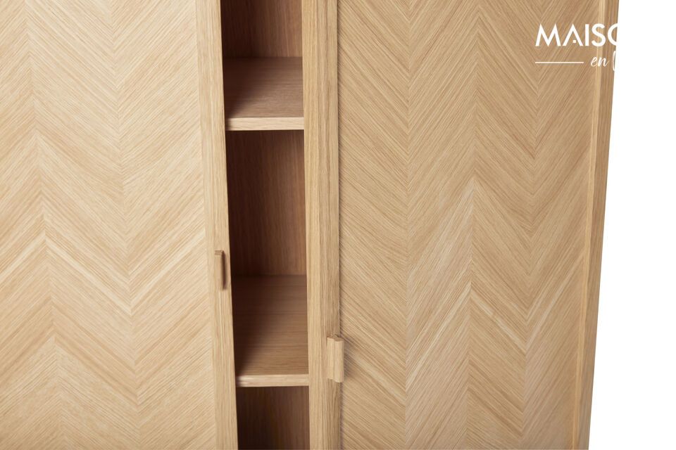 The Herringbone wardrobe size M offers a sophisticated storage solution for your home