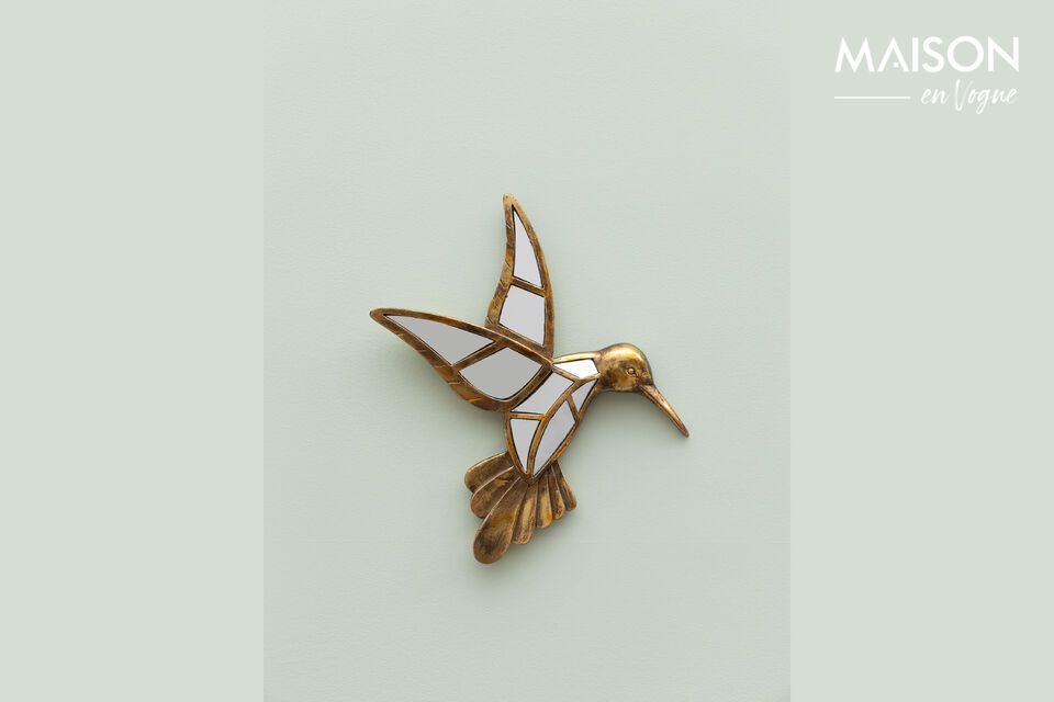 Add a touch of elegant gold with our hummingbird figurine.