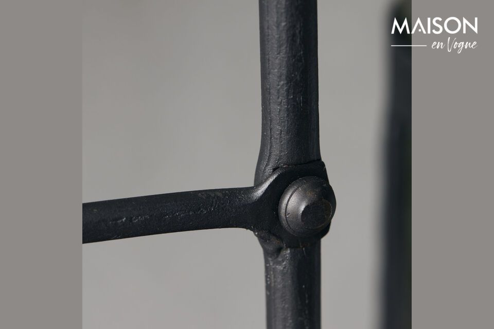 Introduce a warm, refined ambience to your home with the Ira black iron candleholder