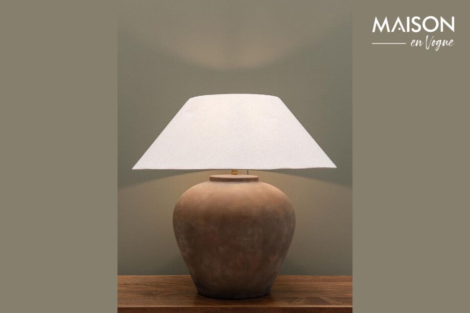 Introduce a timeless design element to your space with our taupe-colored ceramic table lamp