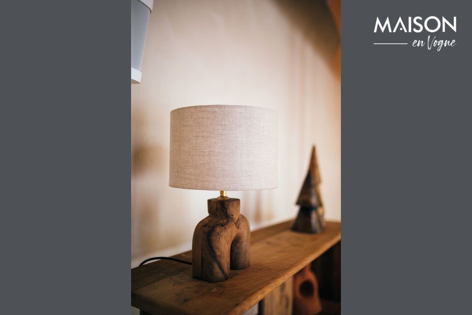 Enhanced by a linen-colored fabric shade, this lamp offers a warm, soft ambience to any room