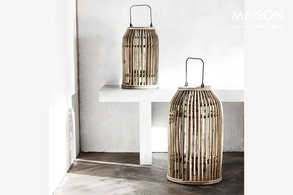 Introduce a touch of warmth and rustic elegance to your home with the Ova natural rattan lantern