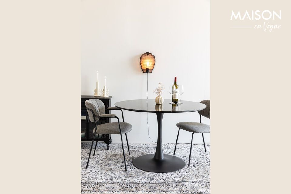 Discover charm and functionality combined in the Maru black marble effect dining table