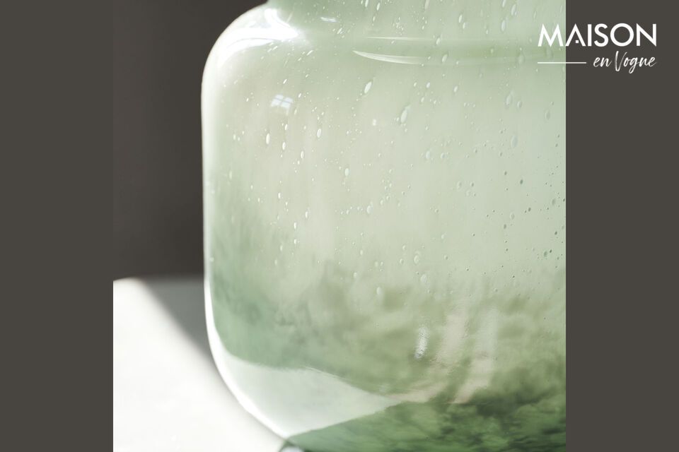 Create a space in harmony with nature with the mint-colored glass vase from House Doctor