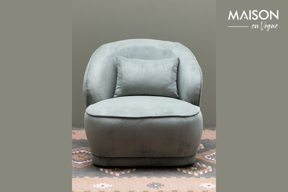 A green armchair combining modern style and lasting comfort.