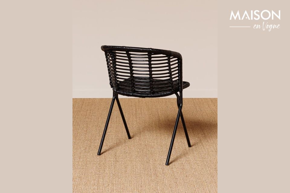 Add a touch of elegance and comfort to your space with this black rattan chair