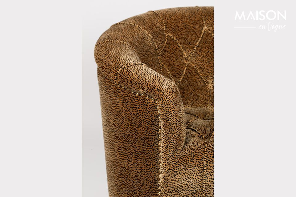 With its soft upholstered seat and leopard-inspired pattern