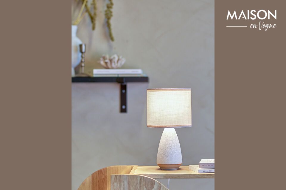 Discover the grace and simplicity of the Paprica white stoneware table lamp