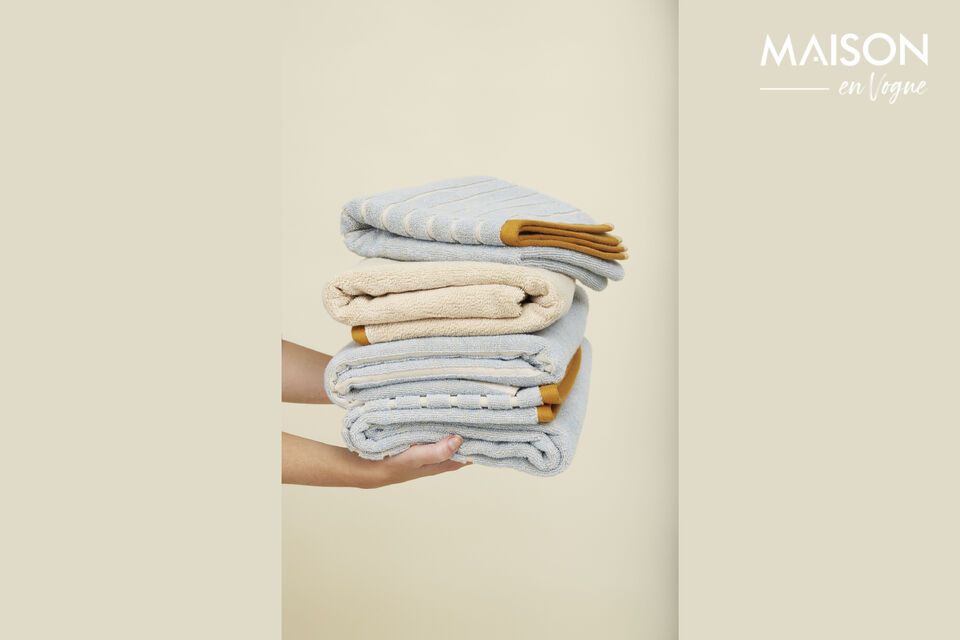 Energize your bathroom routine with the Promenade towel in blue and sand cotton