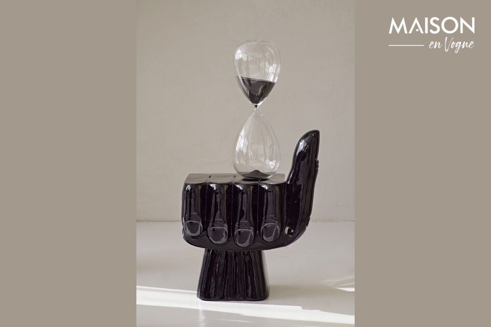 The Black Recycled Glass Hourglass not only stands out for its sleek design and refined style