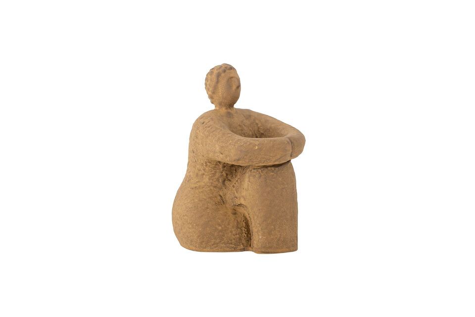 This unique decoration depicts a person seated in a relaxed position