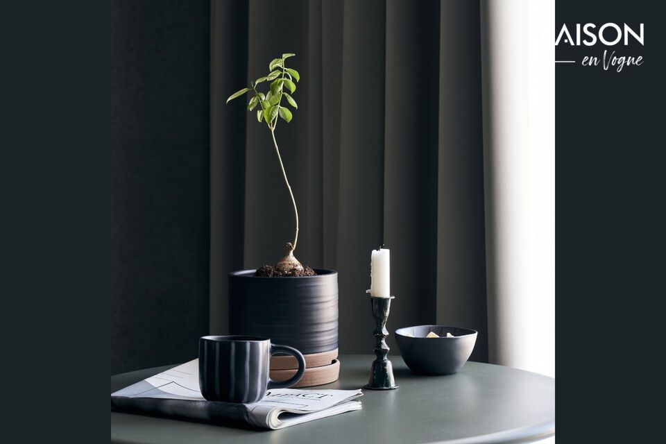 Add a natural touch to your space with the Astu stoneware planter