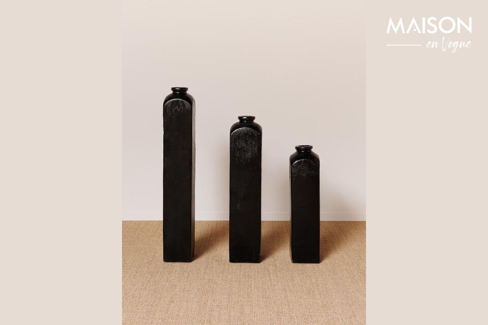 Discover timeless elegance and sophisticated simplicity with our set of three black terracotta vases