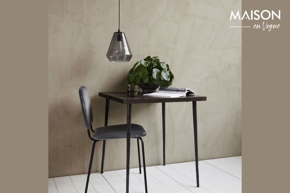 Discover rustic elegance with our black mango table.