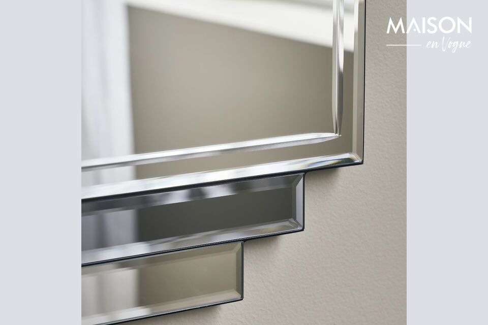 Bring elegance and light to your home with this refined gray mirror.