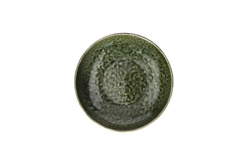 Its exterior features the raw texture of stoneware