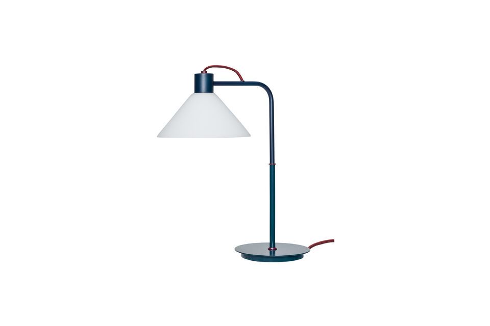 Its blue glass shade creates a soft, subtle light that diffuses a calm, serene ambience