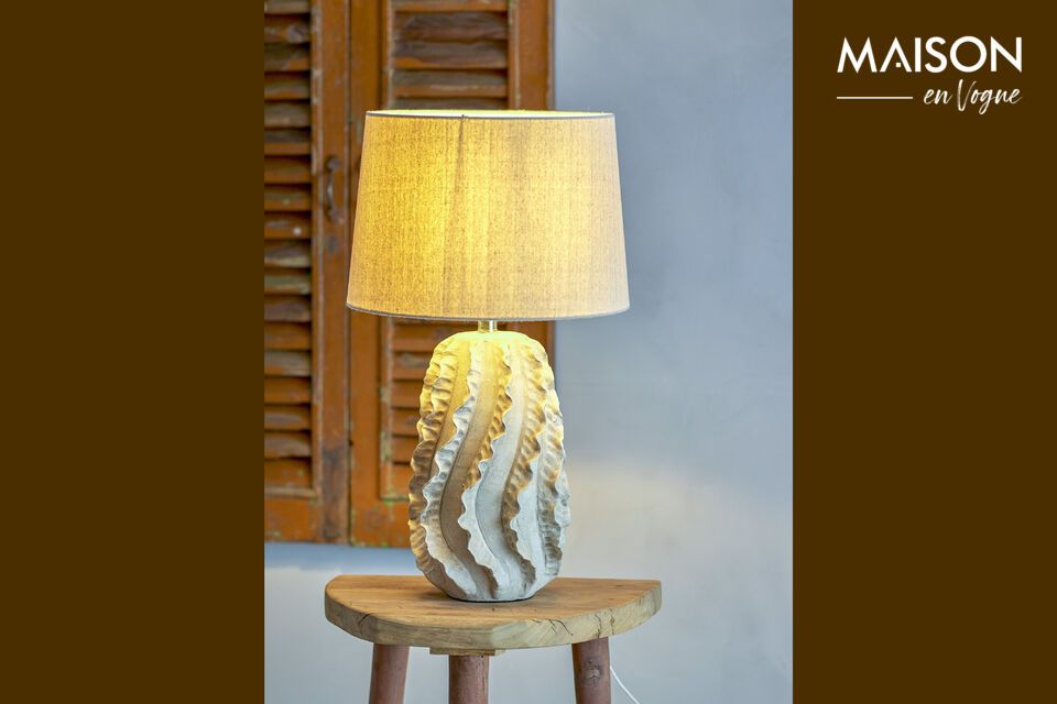 Discover the Natika Table Lamp, a creation that combines aesthetics and craftsmanship