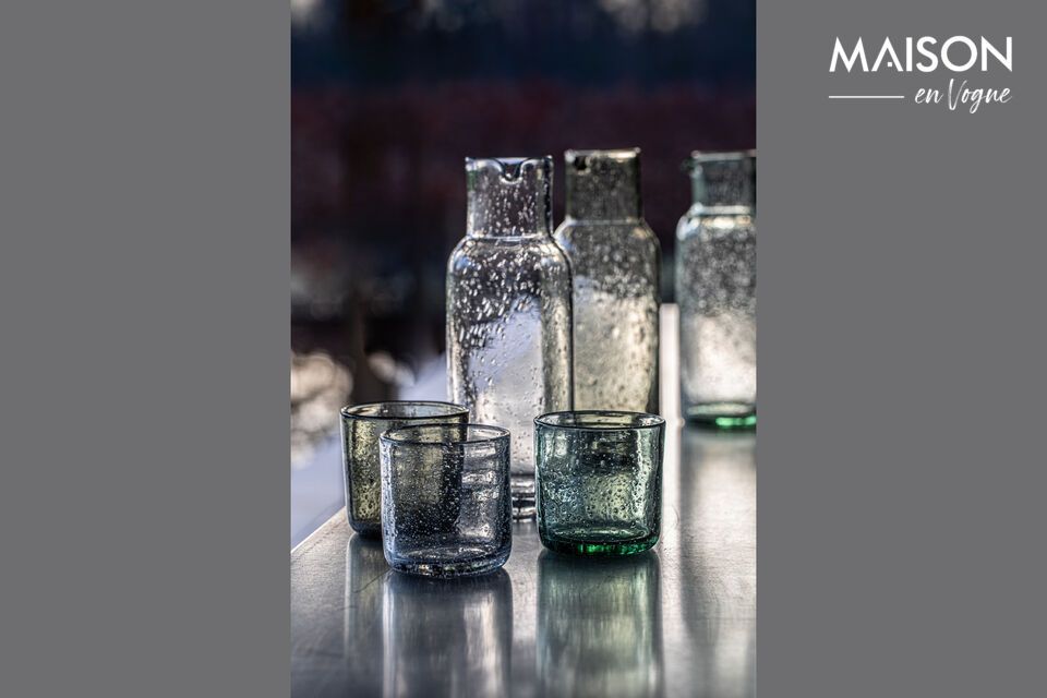 Discover the subtle charm of Vico pale green glass, an elegant addition to any refined table