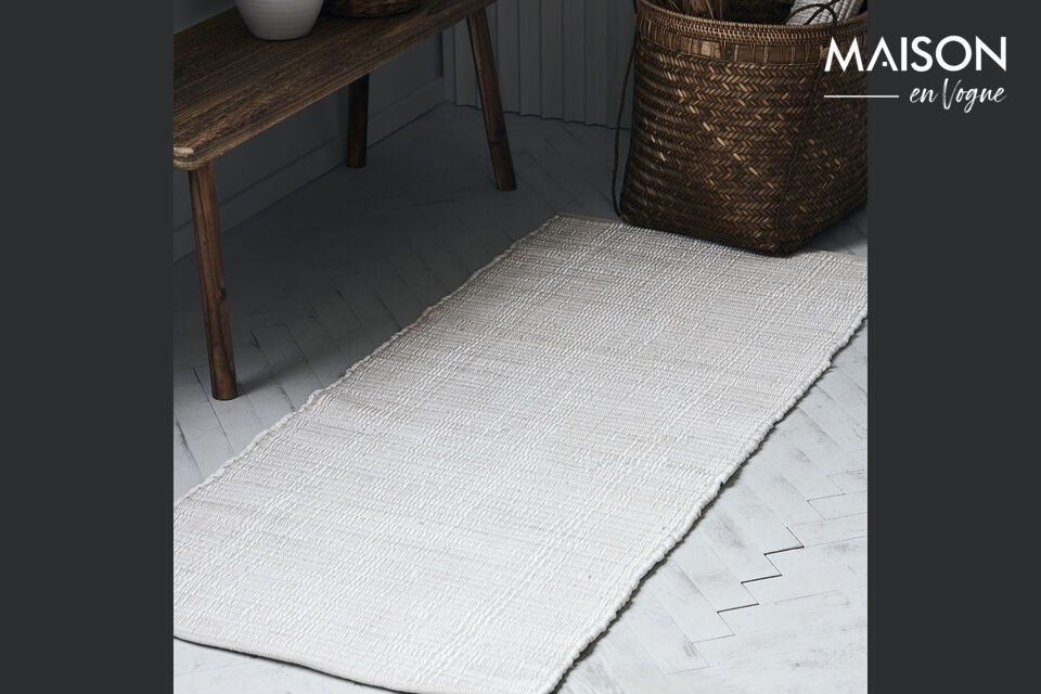 Brighten up your space with this versatile and durable white rug.