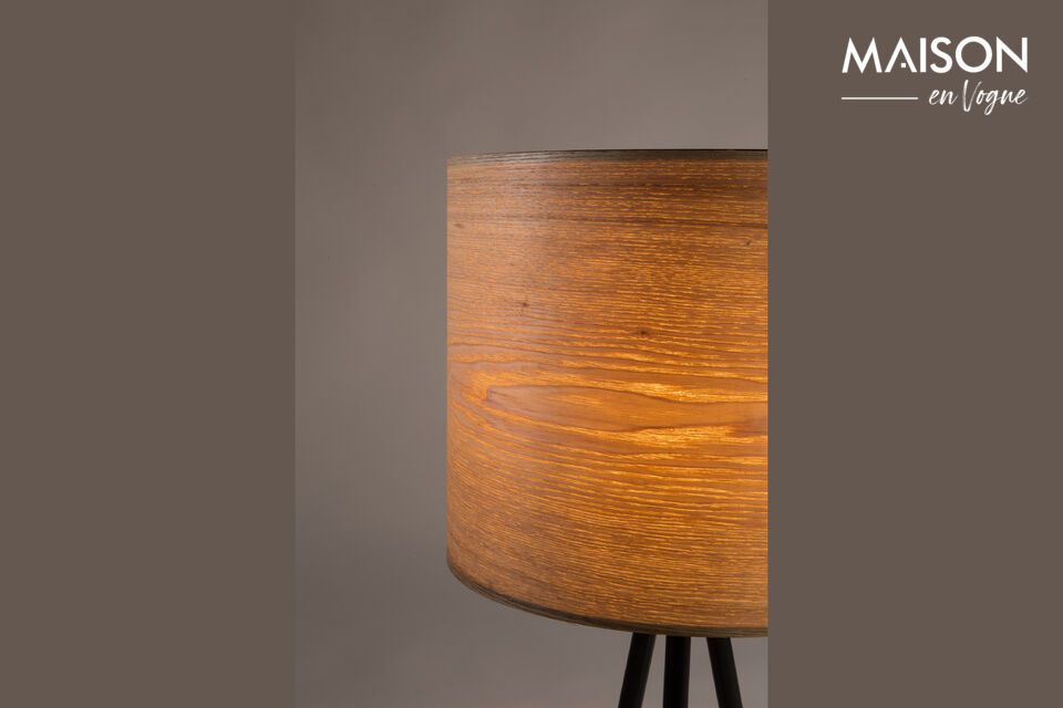 The Woodland table lamp features an ash wood veneered shade, enhanced by a short metal tripod